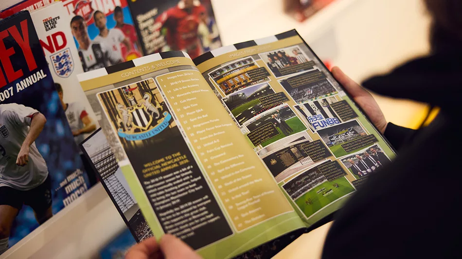 Reading one of the football annuals